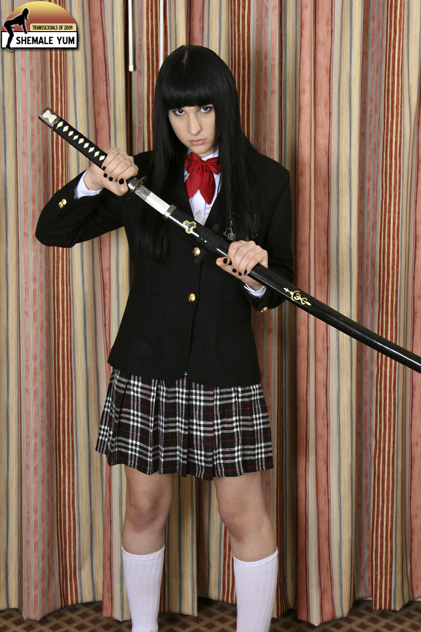 bailey_jay black_hair bowtie clothed_female long_hair looking_at_viewer nail_polish non-nude plaid_skirt porn_star shemale shemaleyum shoes simple_background socks solo sword transgender watermark white