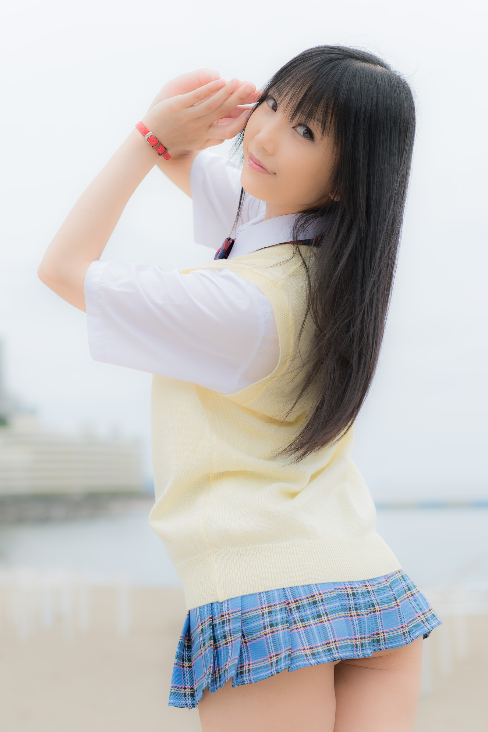 1girl asian black_hair breasts cheek_peek clothed cosplay cute female female_only from_behind lenfried long_hair looking_at_viewer looking_back love_live! love_live!_school_idol_project non-nude outside plaid_skirt smile solo sonoda_umi watermark