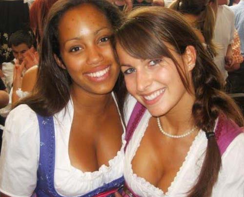 2girls bavaria breasts cleavage dark-skinned_female dark_skin dirndl dress female german long_hair multiple_girls oktoberfest smile
