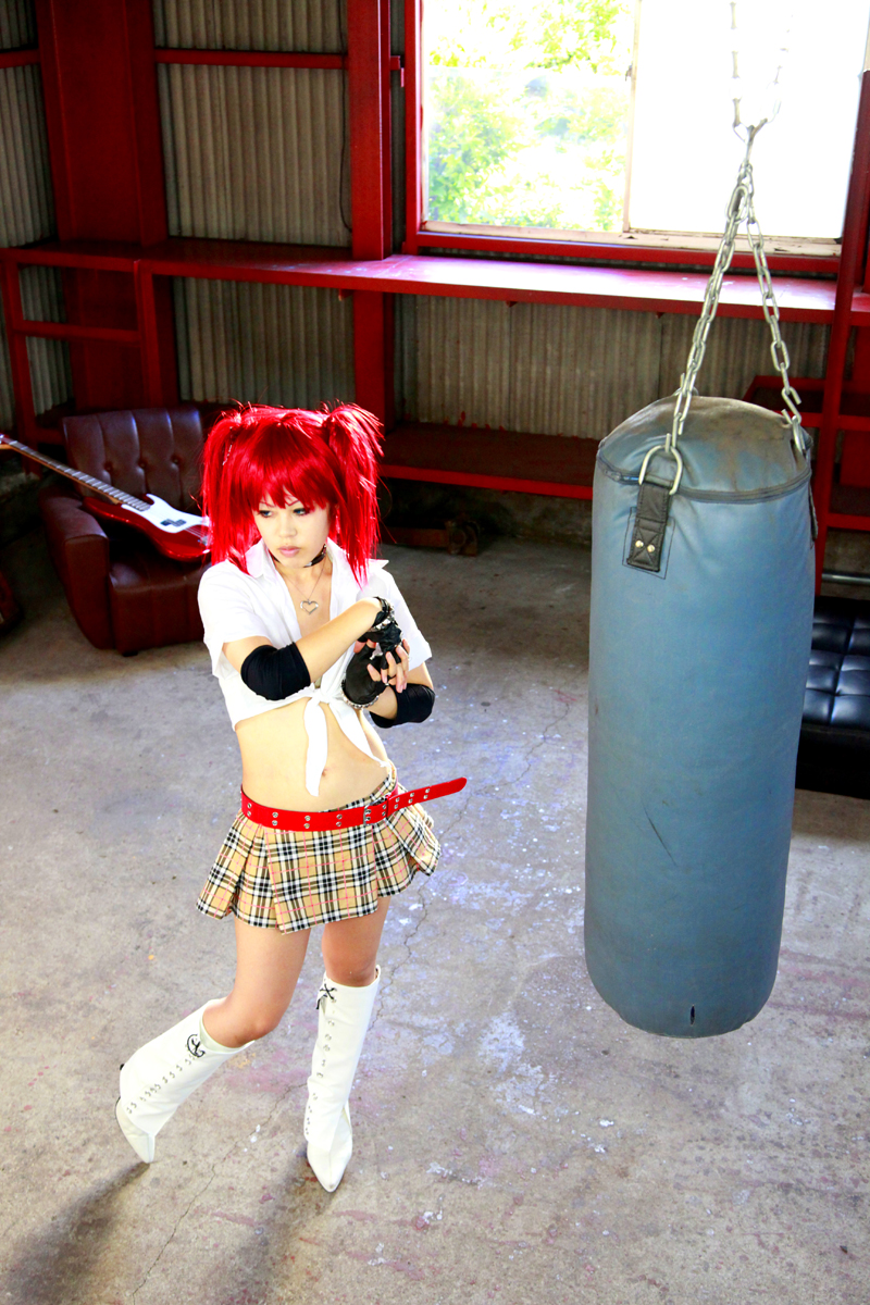 boots breasts female high_heels long_hair midriff pigtails punching_bag red_hair skirt solo