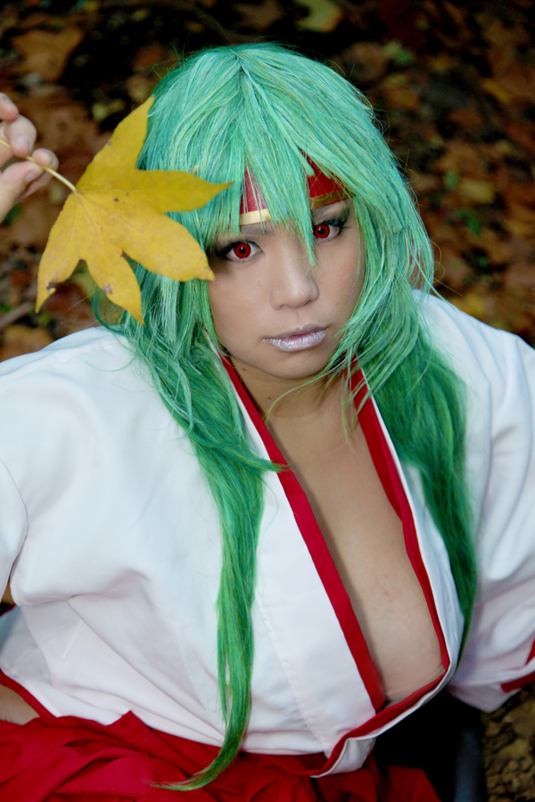 asian breasts chouzuki_maryou cleavage cosplay female green_hair headband huge_breasts long_hair solo