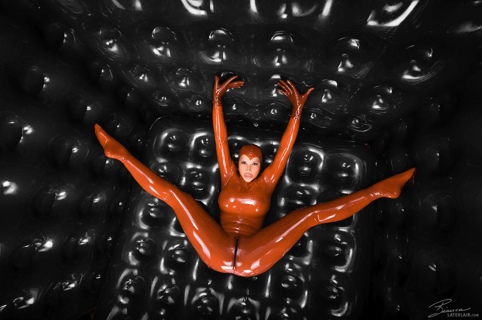 bianca_beauchamp breasts catsuit female gloves large_breasts latex long_hair red_hair solo watermark