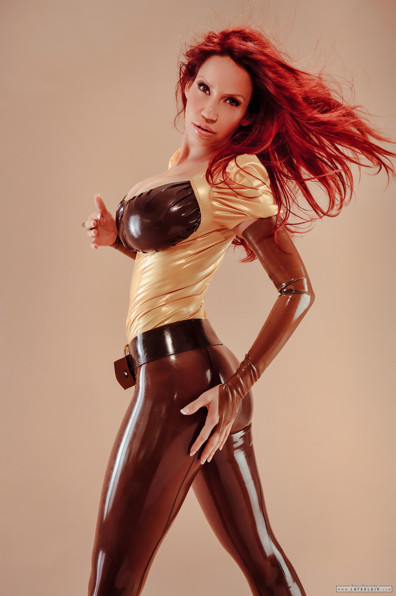 belt bianca_beauchamp breasts female gloves large_breasts latex long_hair midriff red_hair simple_background solo watermark