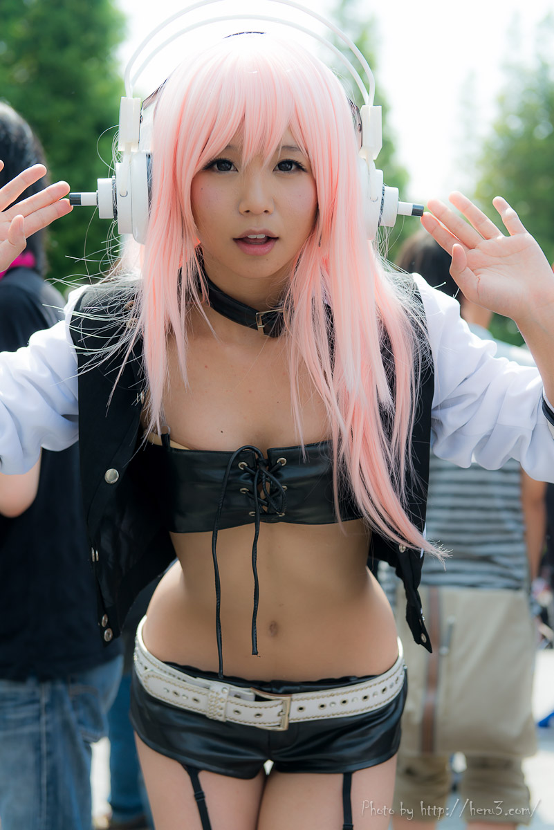 asian breasts cosplay female headphones long_hair midriff navel outside pink_hair solo watermark