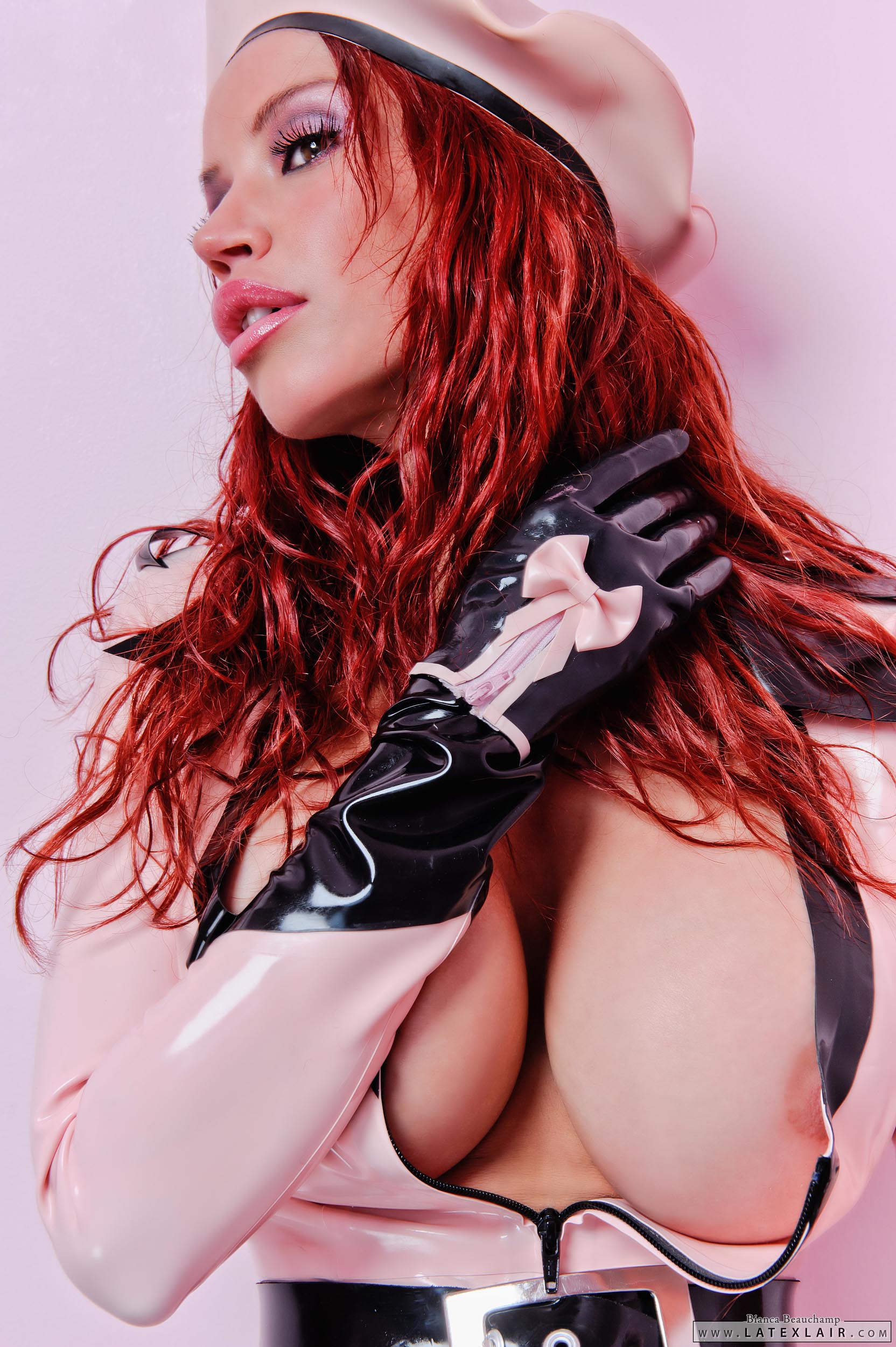 belt bianca_beauchamp breasts female gloves hat high_heels large_breasts latex long_hair red_hair shoes simple_background solo watermark