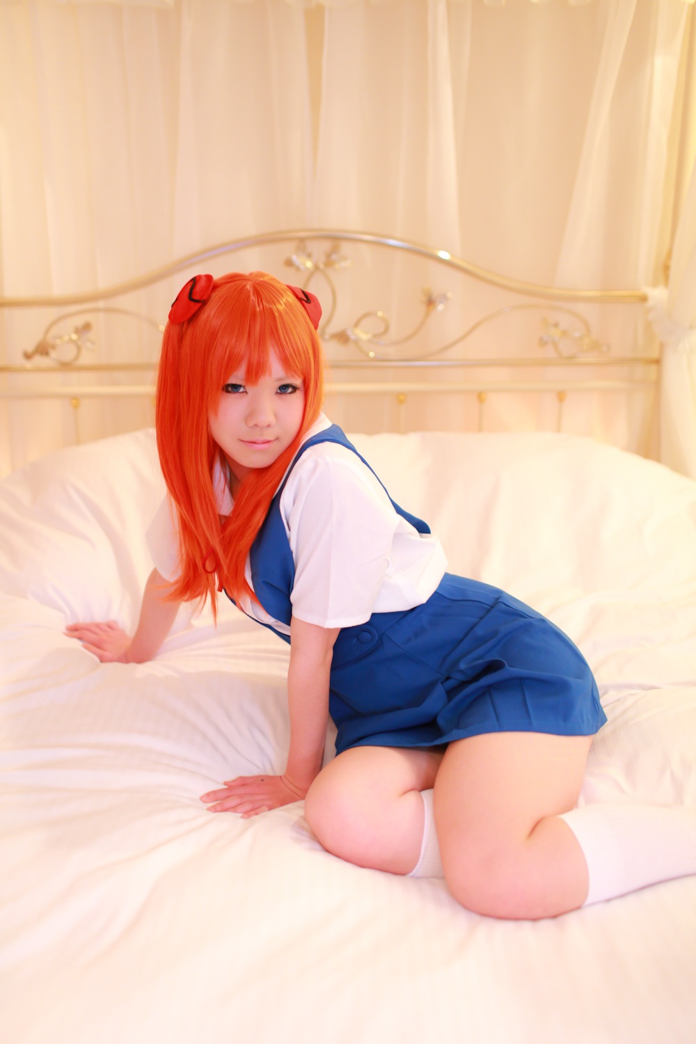 asian asuka_langley_sohryu bed breasts cosplay female long_hair neon_genesis_evangelion orange_hair skirt socks solo