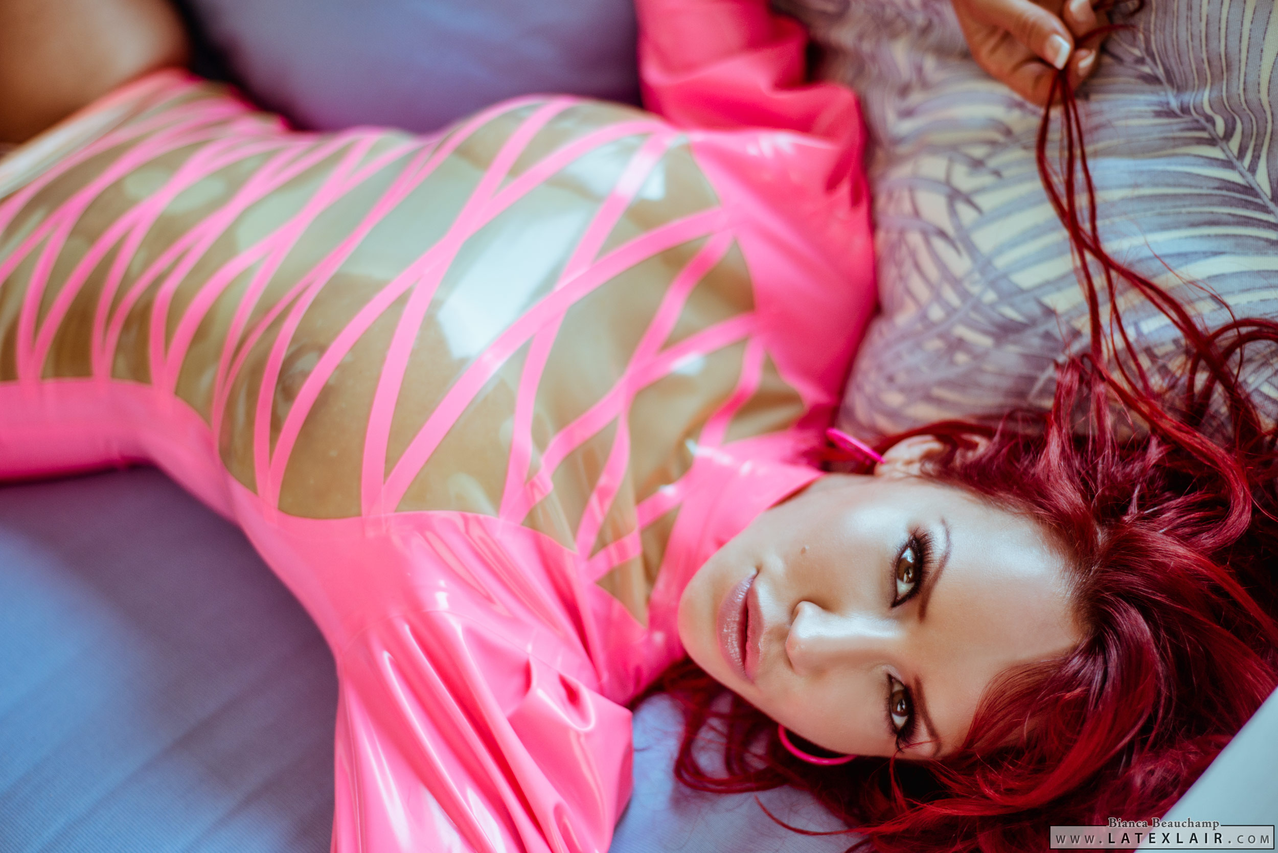 bed bianca_beauchamp breasts dress earrings female large_breasts latex long_hair red_hair see-through solo watermark