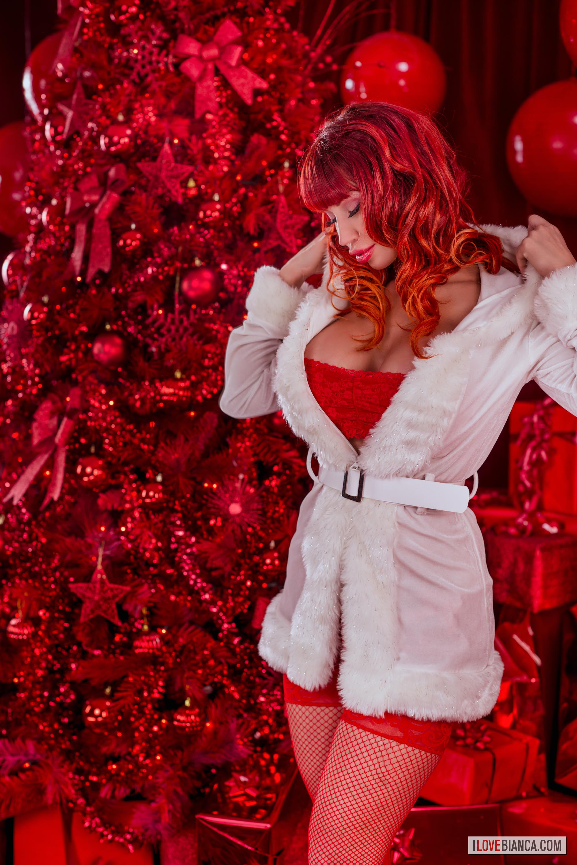 bianca_beauchamp breasts christmas christmas_tree female large_breasts long_hair red_hair solo watermark