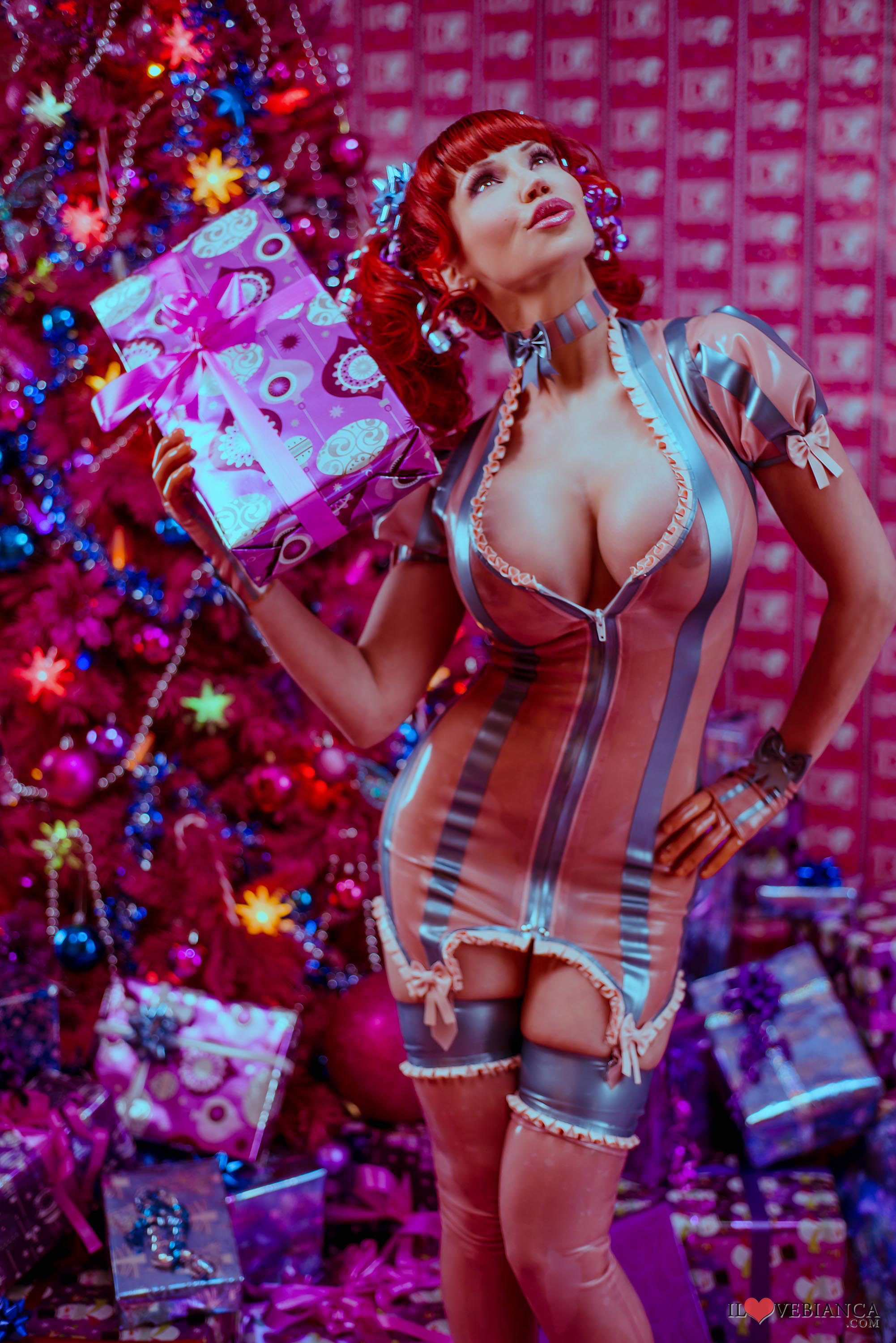 bianca_beauchamp breasts christmas christmas_tree cleavage female large_breasts latex long_hair pigtails red_hair solo thighhighs watermark