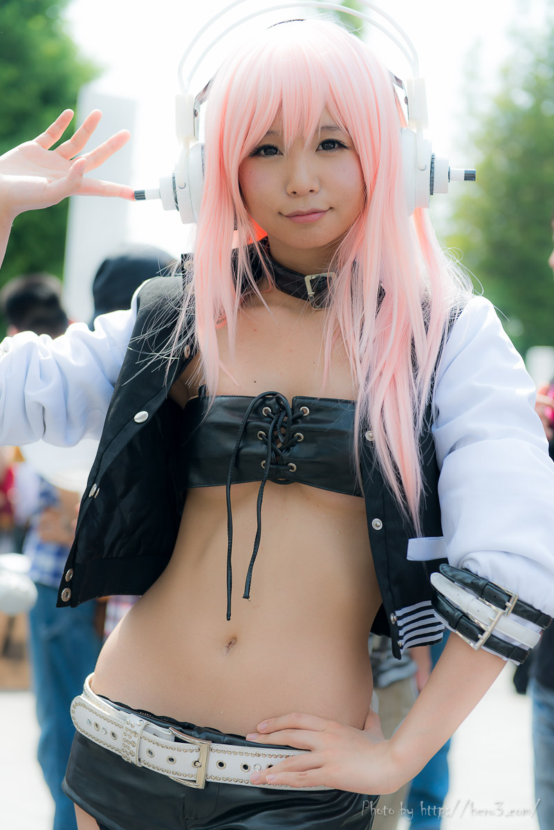 asian breasts cosplay female headphones long_hair midriff navel outside pink_hair solo super_sonico watermark