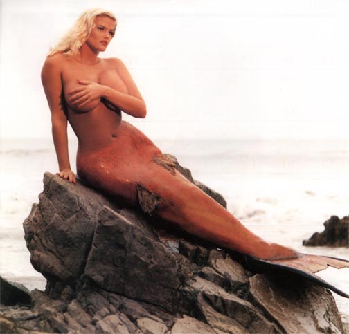 anna_nicole_smith big_breasts blonde breasts cover_up mermaid monster_girl photo solo