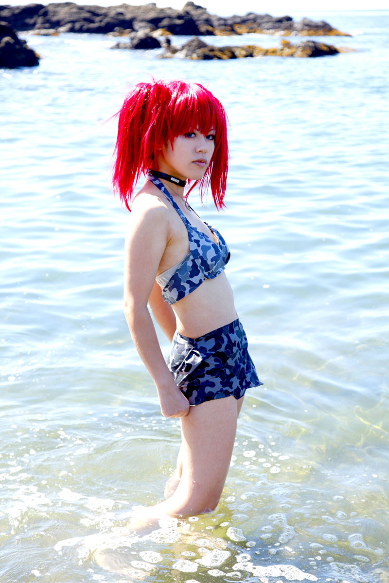 beach bra breasts camouflage_print choker female long_hair midriff necklace outside pigtails red_hair skirt small_breasts solo water