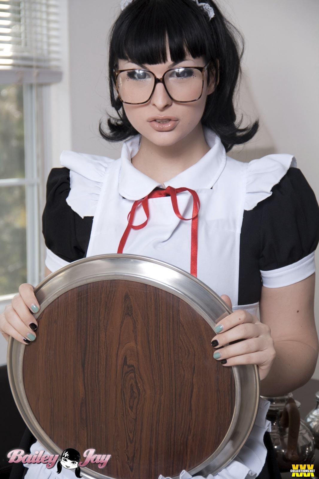 bailey_jay black_hair breasts large_breasts long_hair maid ponytail shemale solo watermark