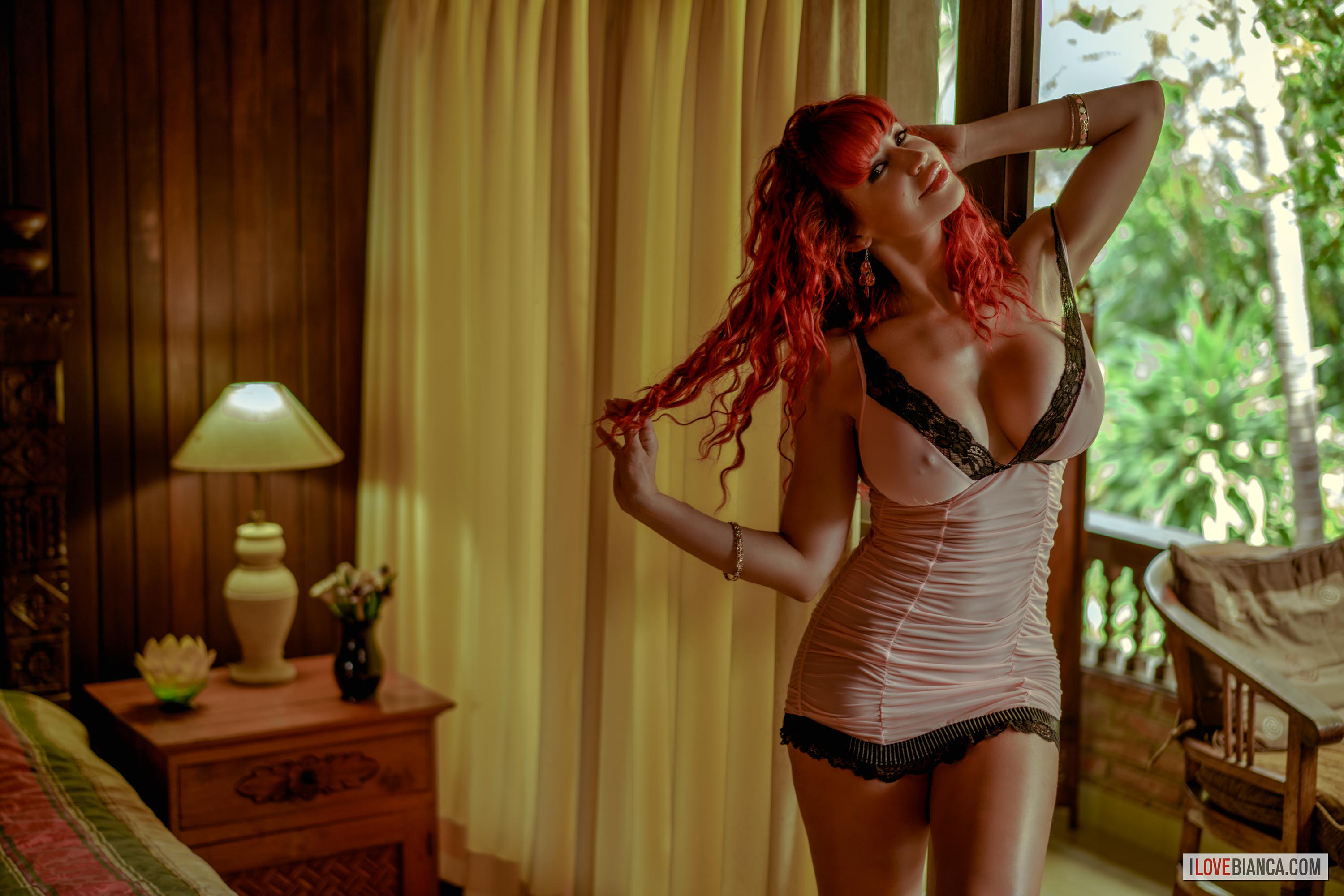 bed bianca_beauchamp breasts fake_breasts female high_heels large_breasts long_hair red_hair shoes solo watermark