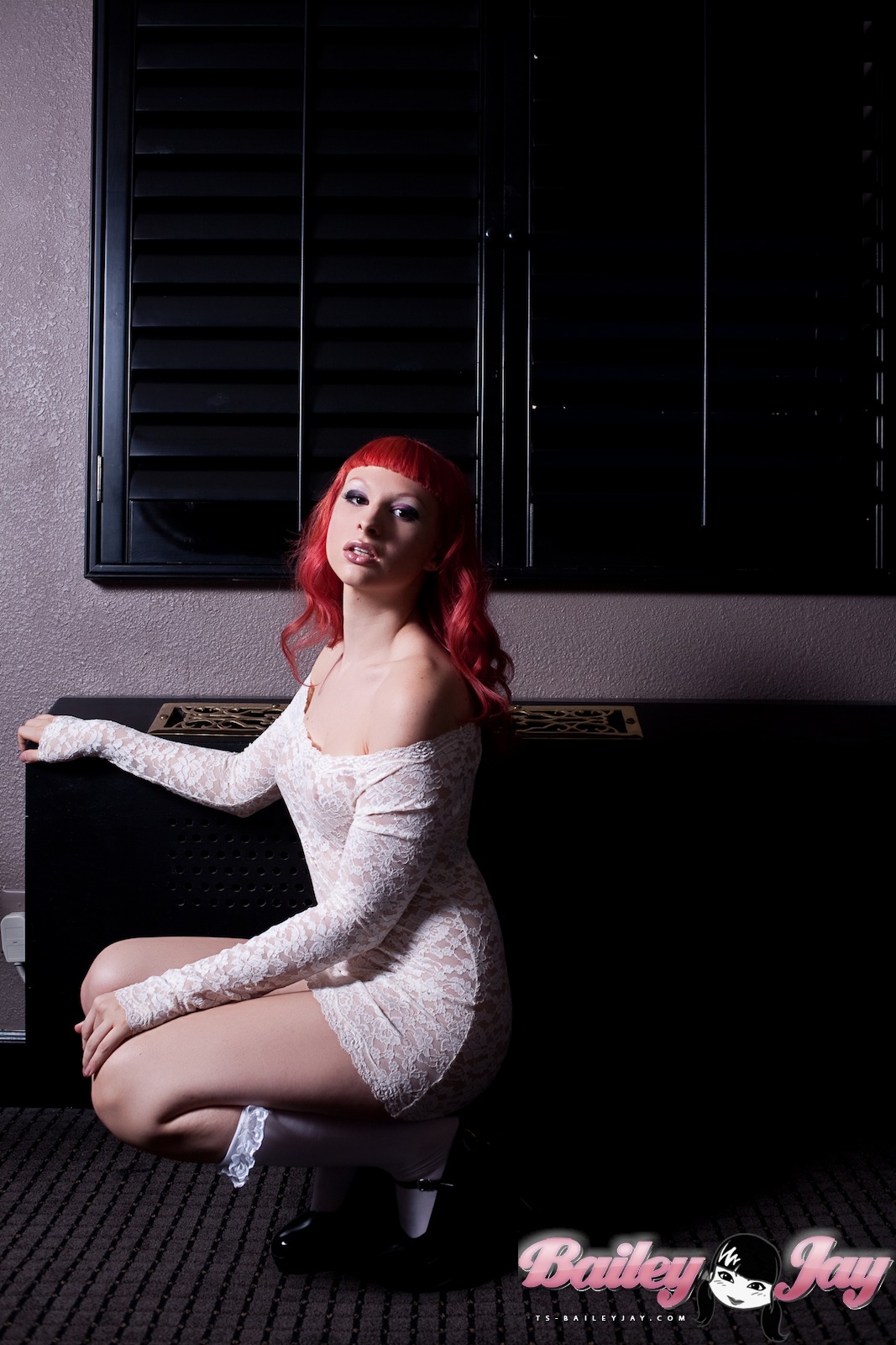 bailey_jay bare_shoulders breasts clothed cute dress high_heels kneesocks long_hair looking_at_viewer mary_janes non-nude parted_lips red_hair shemale shemale_only solo squatting tight_fit watermark white