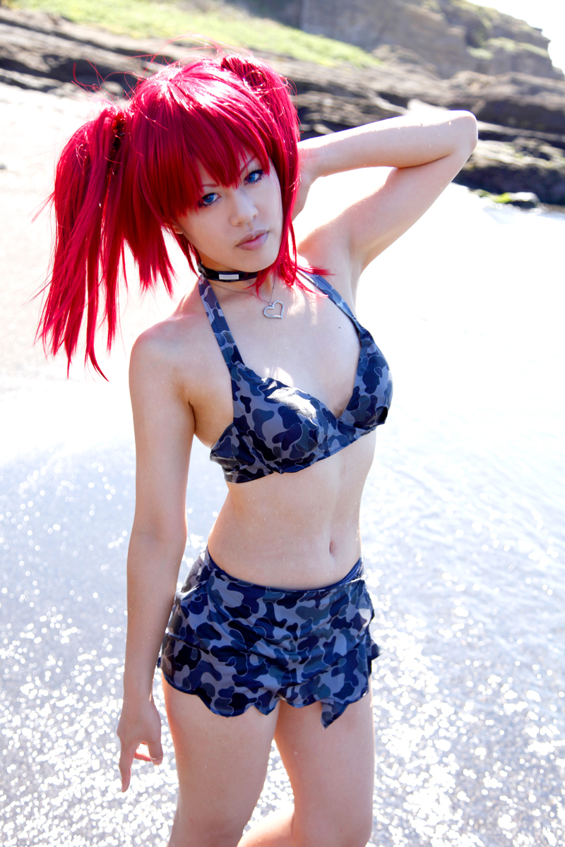 beach bra breasts camouflage_print choker female long_hair midriff necklace outside pigtails red_hair skirt small_breasts solo water