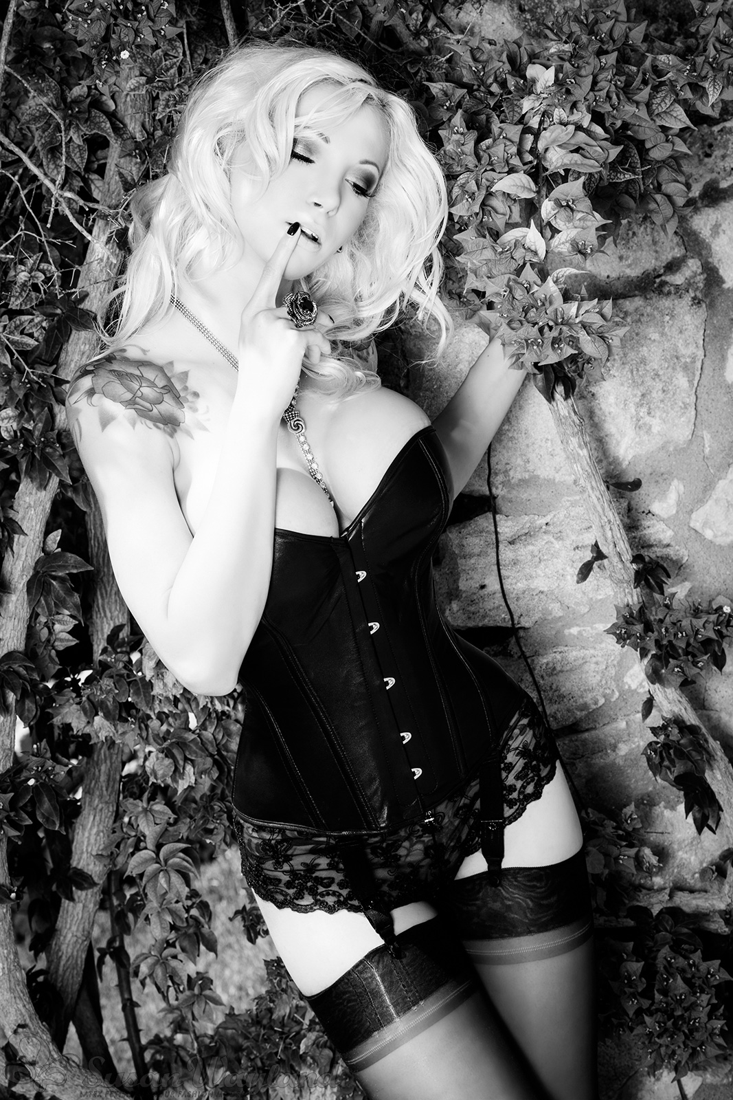 blonde_hair breasts corset female large_breasts latex long_hair monochrome solo susan_wayland watermark