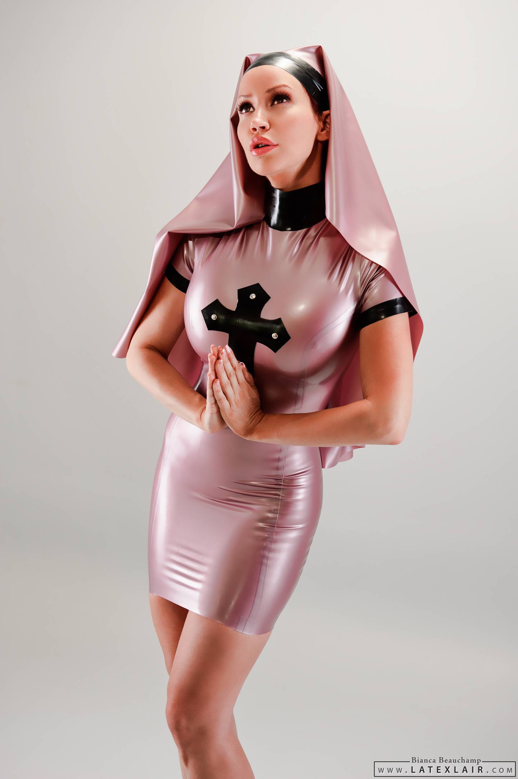 bianca_beauchamp breasts dress female large_breasts latex long_hair nun red_hair simple_background solo watermark