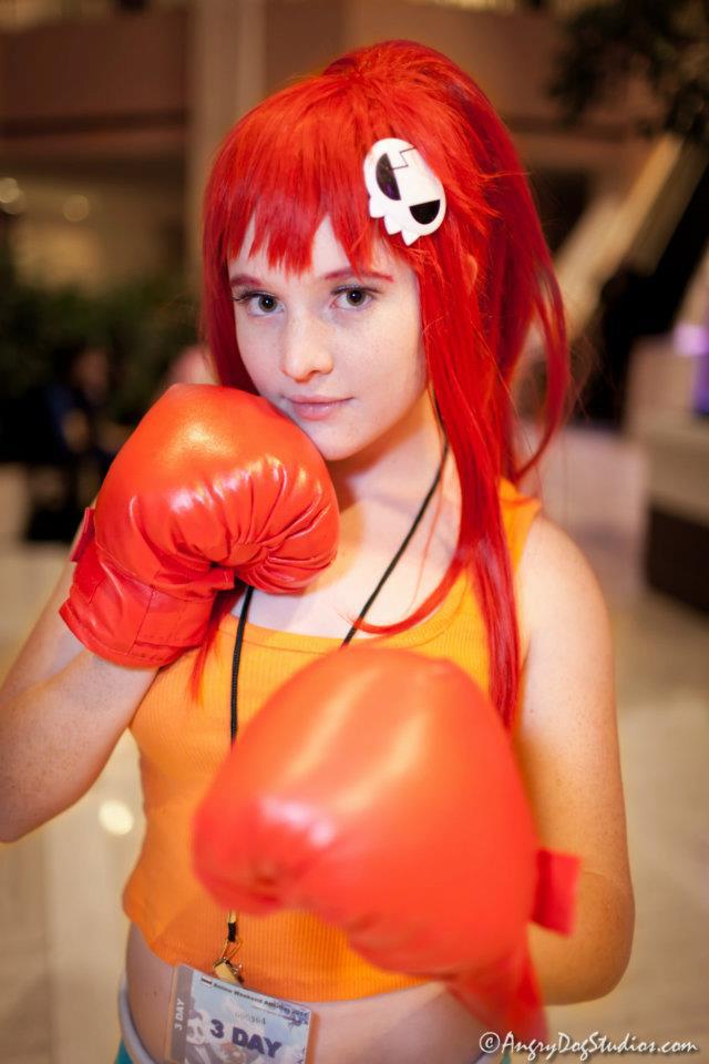 1girl boxing_gloves breasts cosplay female foxycosplay long_hair red_hair solo tagme tengen_toppa_gurren_lagann yoko_littner