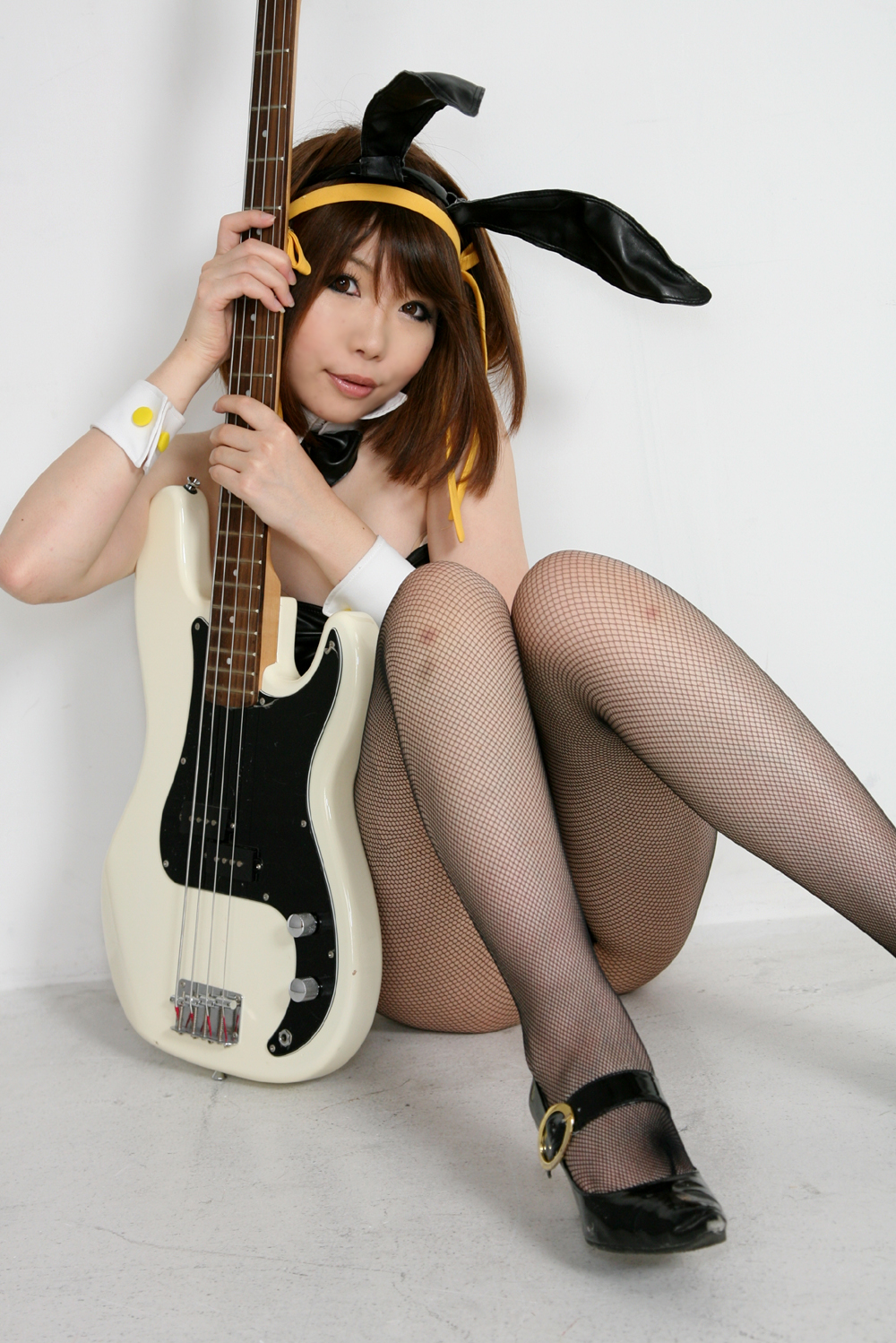 animal_ears asian bare_shoulders breasts brown_hair cosplay female guitar hairband high_heels leotard pantyhose shoes short_hair simple_background solo