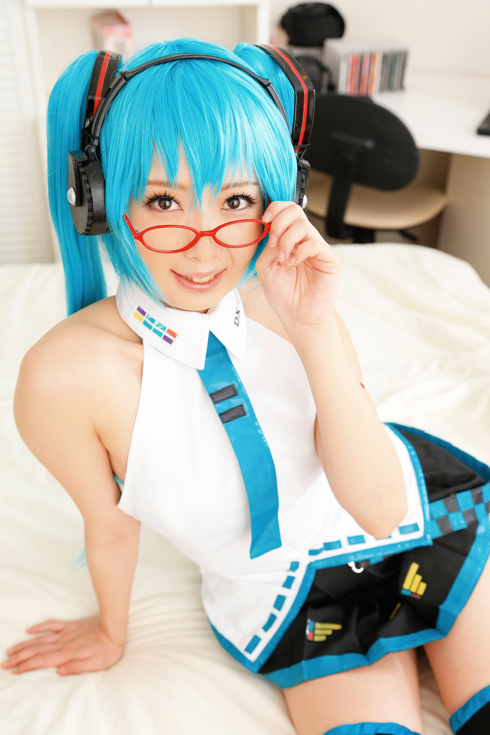 asian bed blue_hair breasts cosplay female glasses headphones high_heels long_hair necktie shoes skirt socks solo