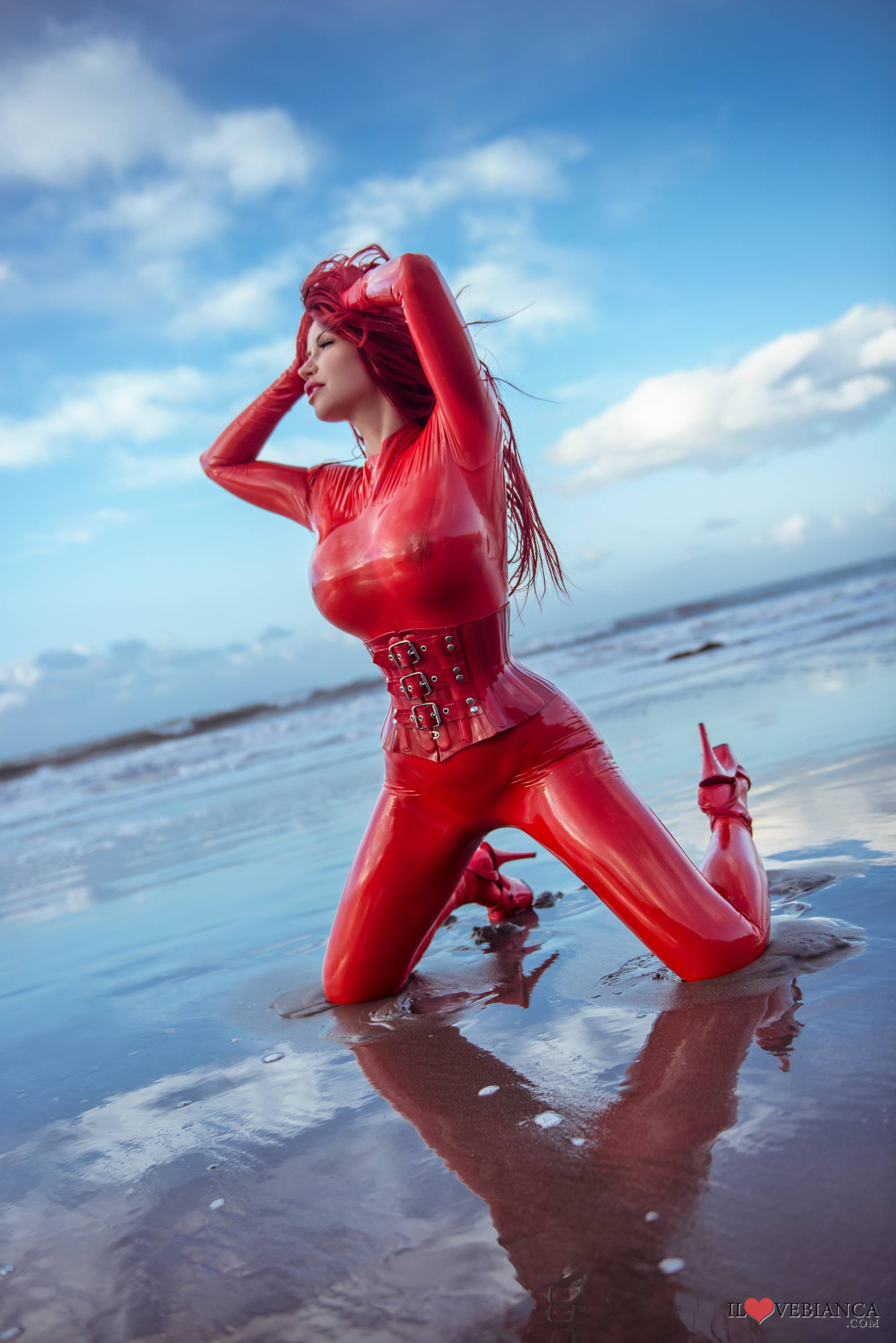 beach bianca_beauchamp breasts catsuit female gloves large_breasts latex long_hair outside red_hair solo water watermark