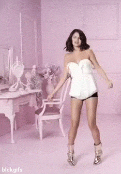 animated celebrity female gif musician real real_person selena_gomez solo text watermark