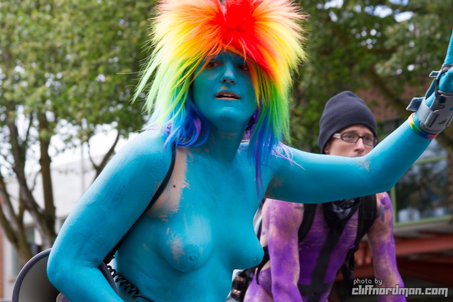 1girl body_paint breasts color cosplay exhibitionism exposed_breasts female friendship_is_magic male my_little_pony outside rainbow_dash rainbow_hair solo