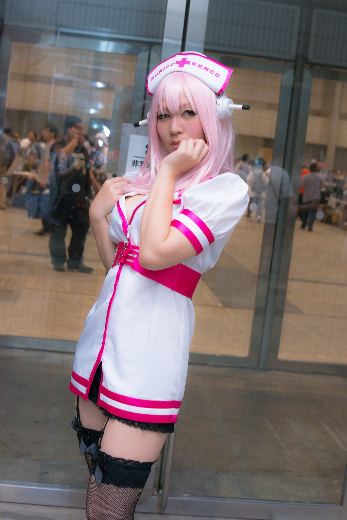 asian breasts cosplay dress female headphones long_hair nurse pink_hair solo