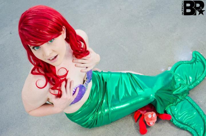 1girl breasts cosplay female from_above long_hair red_hair solo tagme the_little_mermaid