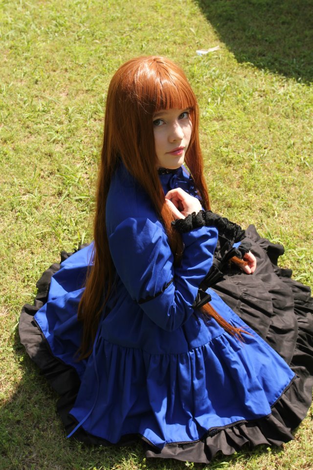 breasts brown_hair cosplay dress female foxycosplay long_hair solo tagme