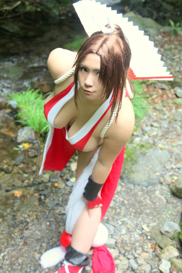 breasts brown_eyes brown_hair chouzuki_maryou cosplay fan female female_only hair_ornament hanging_breasts king_of_fighters large_breasts long_hair mai_shiranui mai_shiranui_(cosplay) plump ponytail pose snk solo thick_thighs thighs tied_hair very_long_hair