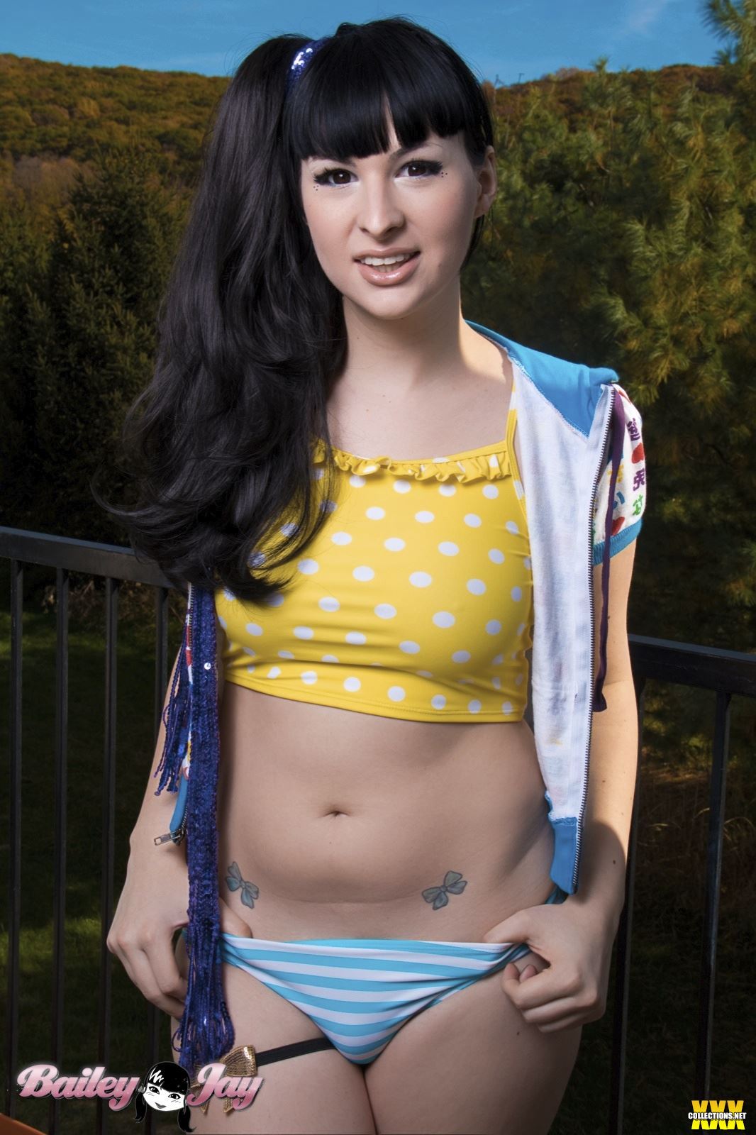 bailey_jay black_hair breasts large_breasts long_hair navel outside ponytail shemale solo tattoo watermark