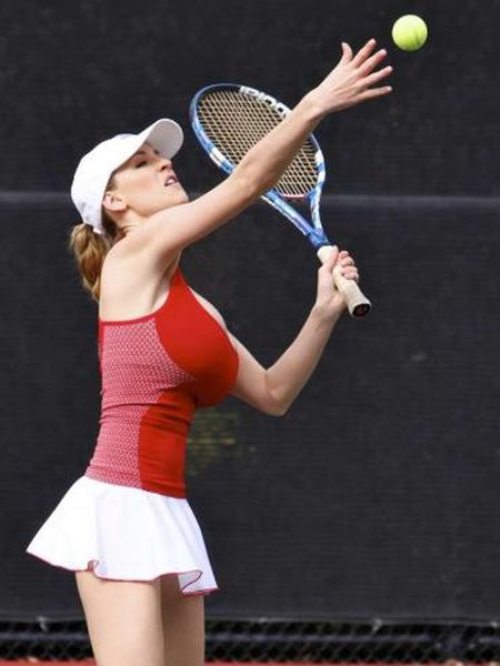 blonde_hair breasts brown_eyes cleavage female hat jordan_carver large_breasts playing_tennis skirt solo tennis