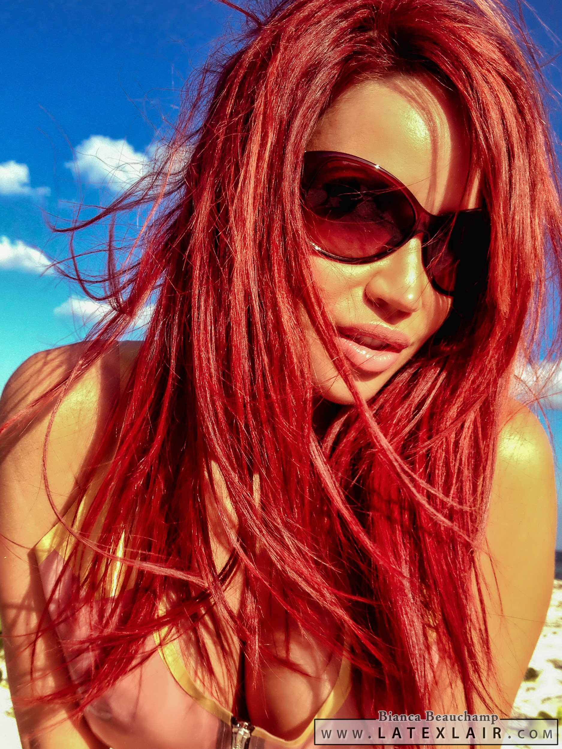 beach bianca_beauchamp breasts cleavage female large_breasts latex leotard long_hair red_hair solo sunglasses swimsuit water watermark