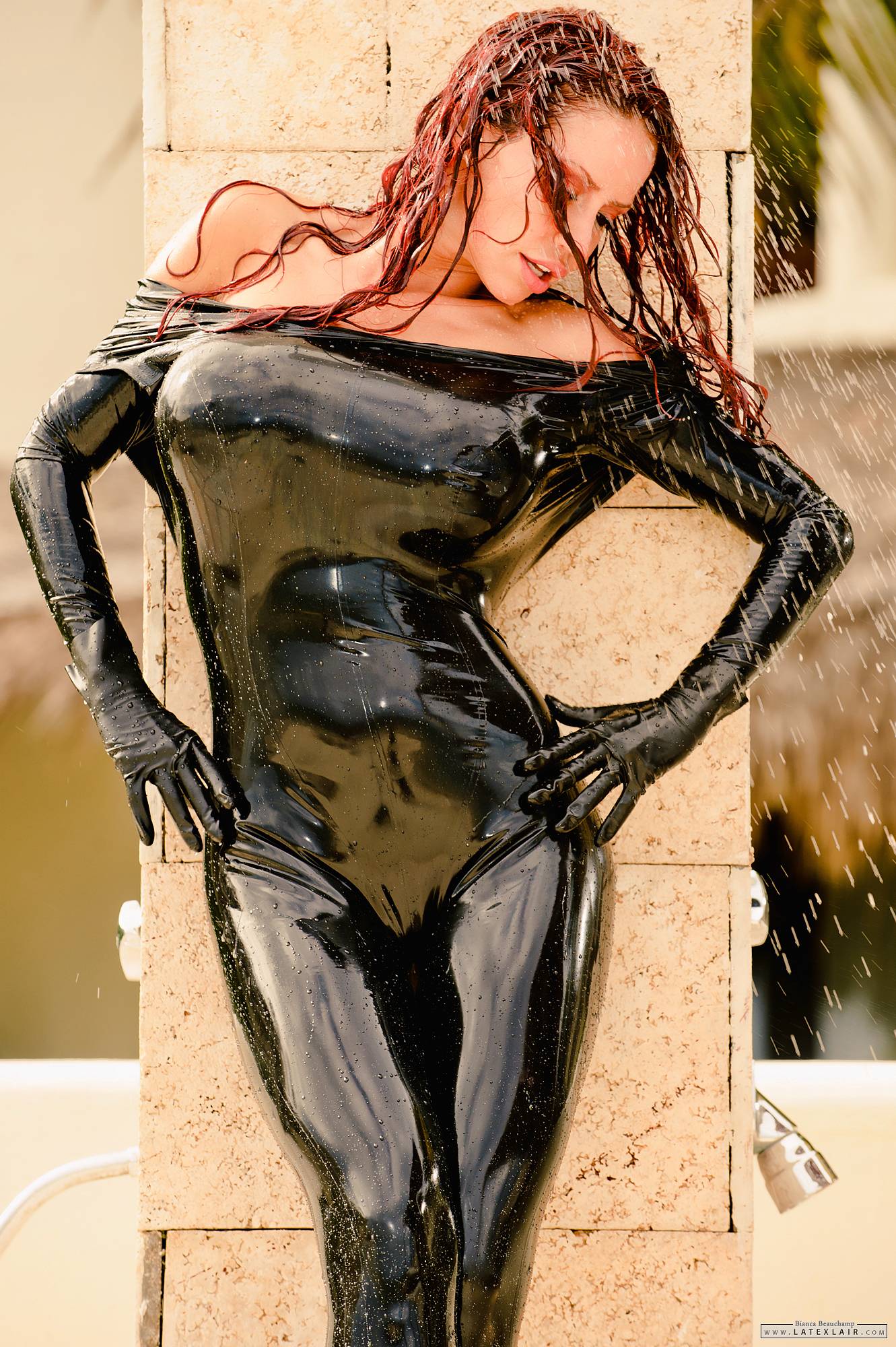 bianca_beauchamp bodysuit breasts female high_heels large_breasts latex long_hair outside red_hair shoes shower solo water watermark wet