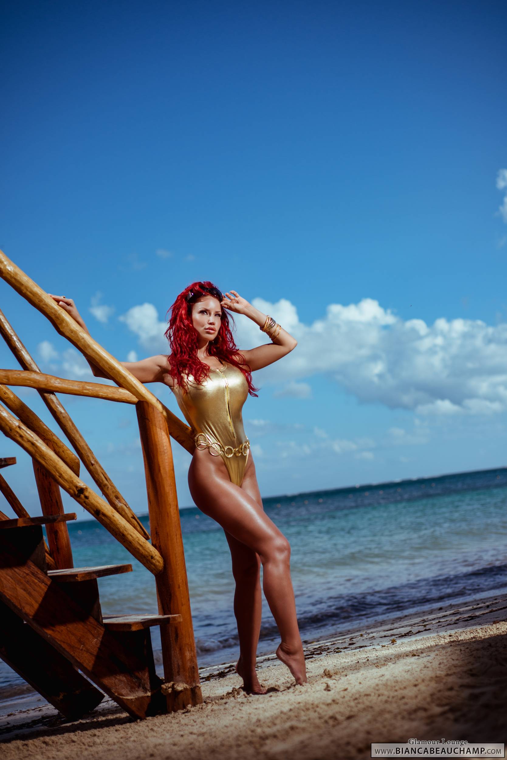 beach bianca_beauchamp breasts female large_breasts latex long_hair red_hair solo stairs swimsuit water watermark