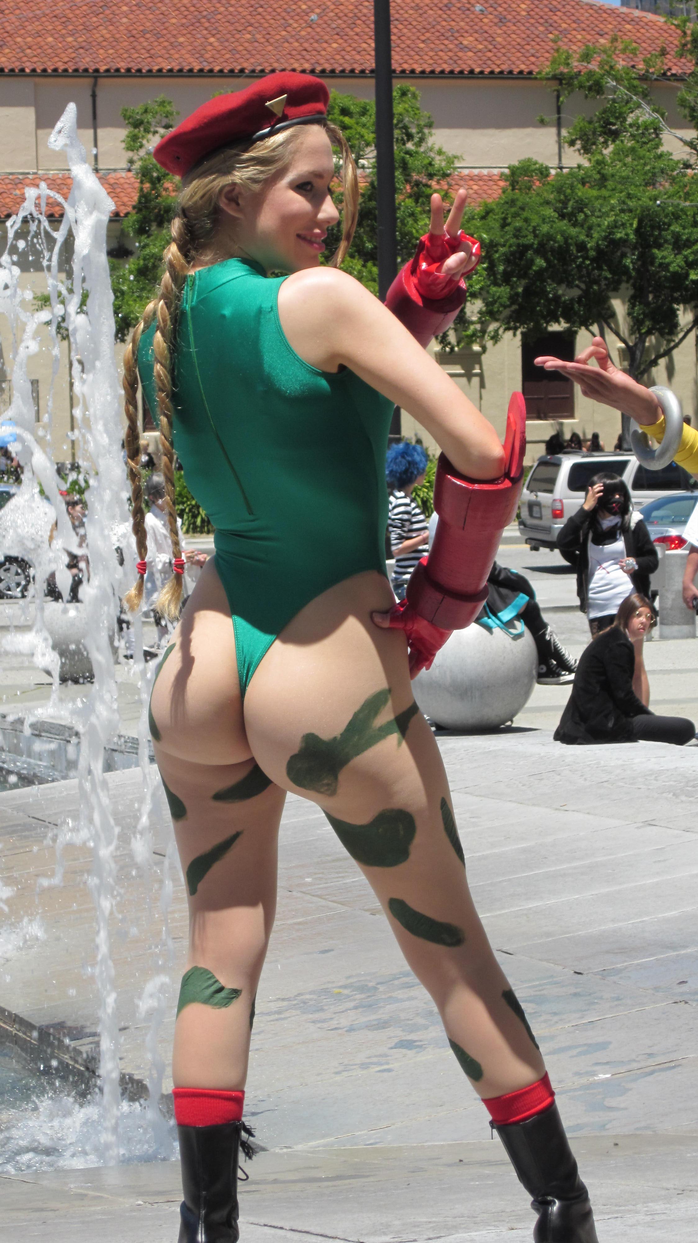 1girl asian ass breasts cammy_white cosplay crystal_graziano female leotard long_hair looking_back outside solo street_fighter