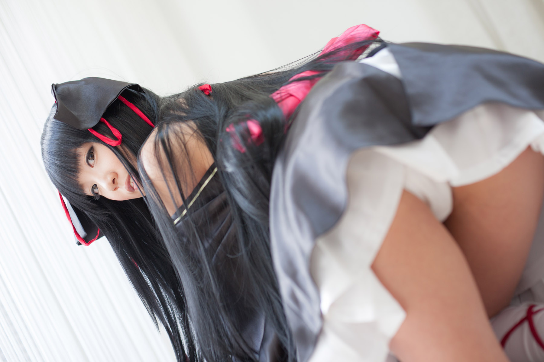 asian ass bare_shoulders black_hair breasts cosplay dress female long_hair looking_back shoes socks solo