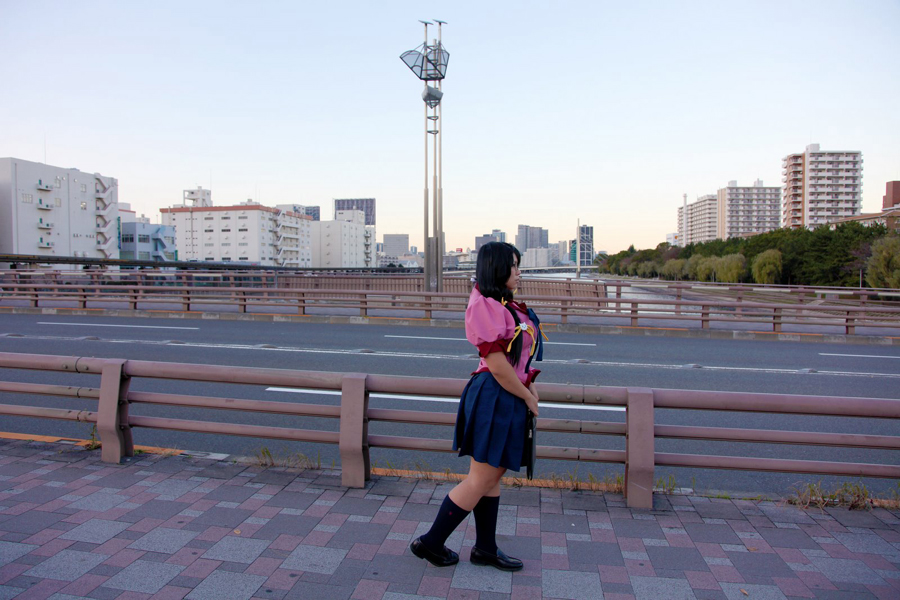 asian black_hair breasts chouzuki_maryou cosplay female glasses huge_breasts long_hair outside shoes skirt socks solo