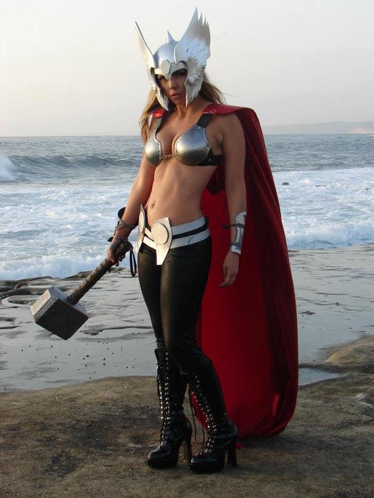 armor beach big_breasts breasts cape cosplay genderswap headgear helmet jane_foster lady_thor long_hair marvel non-nude photo real real_person rule_63 thor_(series) thor_girl weapon