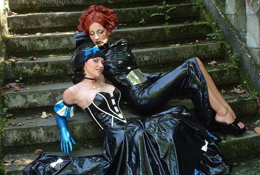 2girls dress female female_only latex marquis photo real_person stairs
