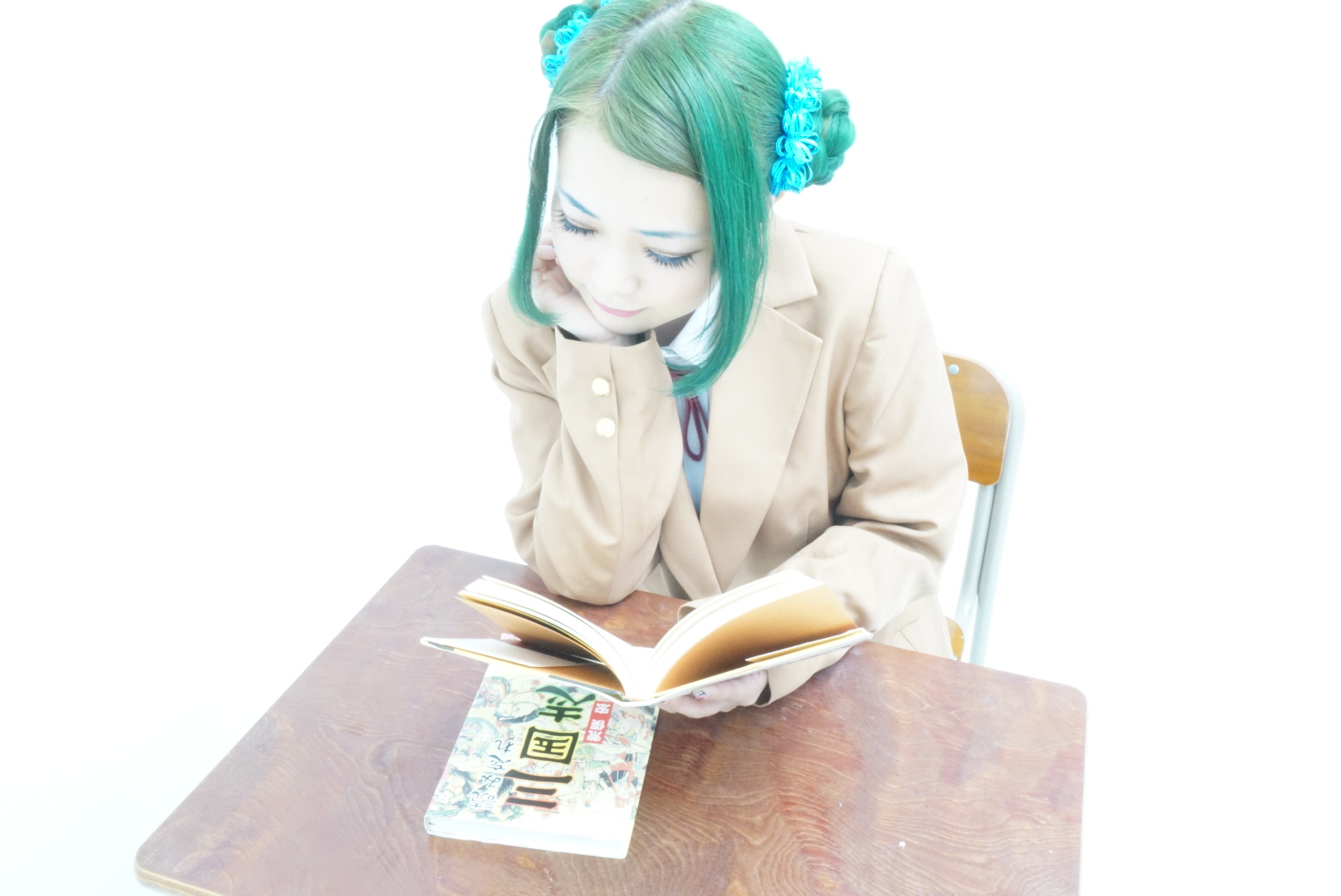 asian book breasts chair cosplay desk female green_hair long_hair shoes sitting skirt smile socks solo