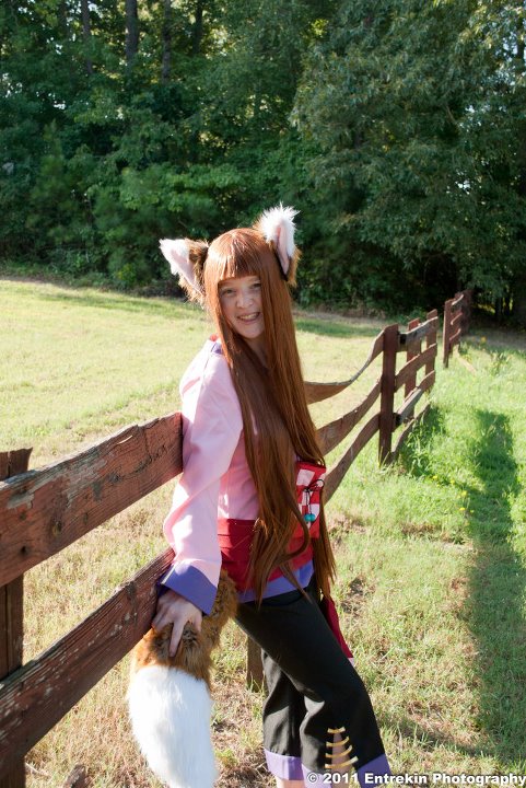 1girl breasts cosplay female holo long_hair outside solo spice_and_wolf tagme