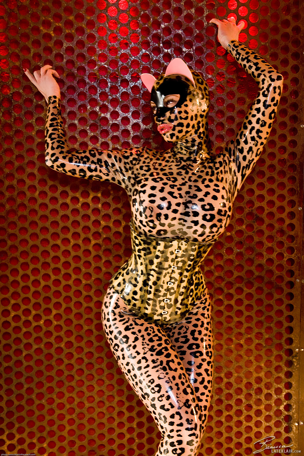 animal_ears arms_up bianca_beauchamp breasts catsuit corset female large_breasts latex leopard_print long_hair red_hair solo