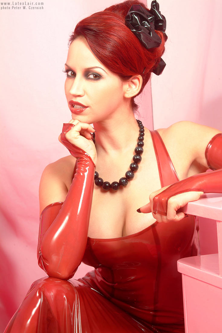 bianca_beauchamp breasts female large_breasts latex long_hair red_hair solo