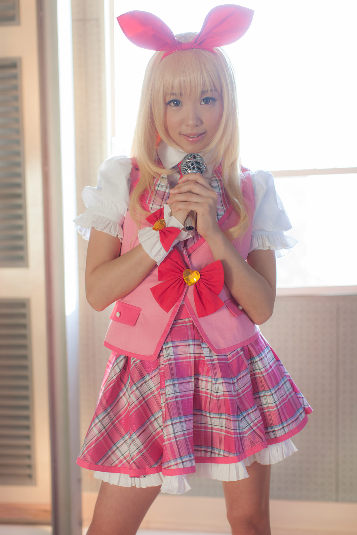 asian blonde_hair breasts cosplay female microphone shoes short_hair skirt solo
