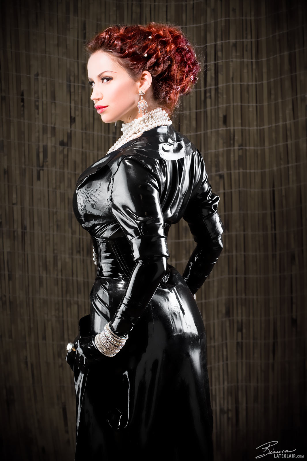 ass bianca_beauchamp breasts female large_breasts latex long_hair looking_back red_hair solo