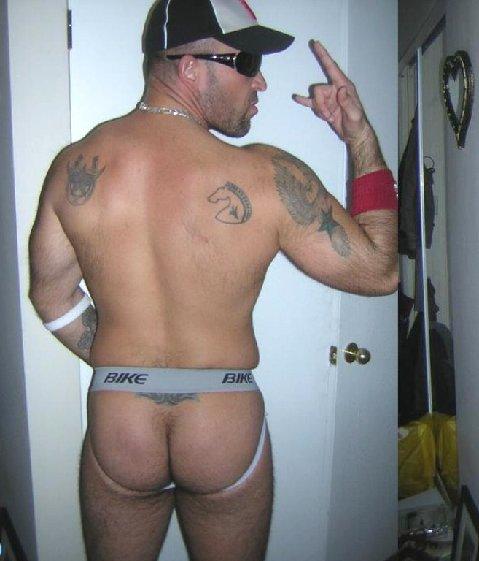1boy ass bara facial_hair glasses hat human jockstrap male male_only nude photo solo solo_focus tattoo