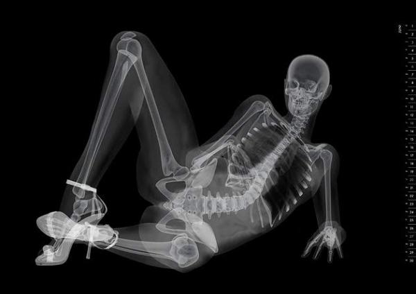 female humor nude posing skeleton spooky x-ray